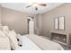Cozy main bedroom with soft lighting, neutral decor, and a comfortable layout for relaxation at 36145 N Desert Tea Dr, Queen Creek, AZ 85140