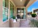 Cozy covered patio featuring comfortable seating, perfect for enjoying the serene backyard ambiance at 36145 N Desert Tea Dr, Queen Creek, AZ 85140