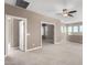 Spacious carpeted upstairs landing with multiple entry doors and windows at 36145 N Desert Tea Dr, Queen Creek, AZ 85140