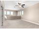 Open carpeted upstairs landing features natural light and neutral tones at 36145 N Desert Tea Dr, Queen Creek, AZ 85140