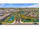 Aerial view showcases a community with water features, lush landscaping, and well-maintained homes at 4077 S Sabrina Dr # 48, Chandler, AZ 85248
