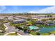 An aerial view of a community with a pool, lake, and lush green landscaping at 4077 S Sabrina Dr # 48, Chandler, AZ 85248