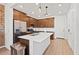 Modern kitchen features stainless steel appliances, wood cabinets, and a bright white island at 4077 S Sabrina Dr # 48, Chandler, AZ 85248