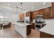 Open-concept kitchen with a large island, stainless steel appliances, and access to the living area at 4077 S Sabrina Dr # 48, Chandler, AZ 85248