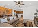 Spacious living room open to dining area, bar and kitchen with hardwood floors and brick accent wall at 4077 S Sabrina Dr # 48, Chandler, AZ 85248