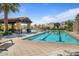 Community swimming pool with ample seating and shaded areas at 4077 S Sabrina Dr # 48, Chandler, AZ 85248