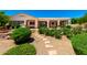 Backyard features stone walkway, desert landscaping, and covered patio with a pool at 4633 E Chaparosa Way, Cave Creek, AZ 85331