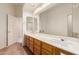 Bathroom featuring a large vanity with double sinks, mirrors, and great lighting at 4633 E Chaparosa Way, Cave Creek, AZ 85331