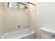 Bright bathroom featuring a tub and shower combination, accented by a window bringing in natural light at 4633 E Chaparosa Way, Cave Creek, AZ 85331