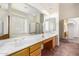 Bathroom offers dual sinks, a large mirror, soaking tub, and glass block window at 4633 E Chaparosa Way, Cave Creek, AZ 85331