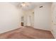 Carpeted bedroom with an ensuite bathroom, closet, and ceiling fan at 4633 E Chaparosa Way, Cave Creek, AZ 85331