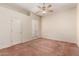 Bedroom featuring carpeting, a ceiling fan, a window, and natural light at 4633 E Chaparosa Way, Cave Creek, AZ 85331