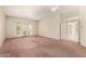 Large bedroom with ceiling fan, neutral paint, and sliding patio doors to the exterior at 4633 E Chaparosa Way, Cave Creek, AZ 85331
