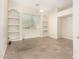 Spacious room with neutral walls, tile floors, and built-in shelving around the window at 4633 E Chaparosa Way, Cave Creek, AZ 85331