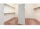 Walk-in closet provides ample storage with shelving and hanging rods at 4633 E Chaparosa Way, Cave Creek, AZ 85331