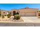 Charming single-story home with a terracotta-tiled roof, neutral stucco, and a two-car garage at 4633 E Chaparosa Way, Cave Creek, AZ 85331