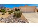 Inviting single-story home with desert landscaping and a two-car garage at 4633 E Chaparosa Way, Cave Creek, AZ 85331