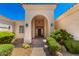 Stunning arched entryway with decorative lighting and desert landscaping at 4633 E Chaparosa Way, Cave Creek, AZ 85331