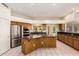 Kitchen with stainless steel appliances, granite countertops, and a large island at 4633 E Chaparosa Way, Cave Creek, AZ 85331