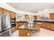 Kitchen with stainless steel appliances, granite countertops and center island at 4633 E Chaparosa Way, Cave Creek, AZ 85331