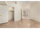 Open living room featuring tile flooring with views into other rooms through doorways at 4633 E Chaparosa Way, Cave Creek, AZ 85331