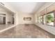 Open living area with tile flooring and large windows overlooking the pool and backyard at 4633 E Chaparosa Way, Cave Creek, AZ 85331