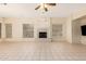 Spacious living room featuring a fireplace and tile flooring at 4633 E Chaparosa Way, Cave Creek, AZ 85331