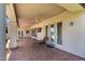 Relaxing covered patio with tiled floor, ceiling fans, and comfortable lounge seating at 4633 E Chaparosa Way, Cave Creek, AZ 85331