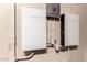 Tesla Powerwall with backup gateway installed on a wall with electrical outlets at 4633 E Chaparosa Way, Cave Creek, AZ 85331