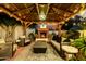 Cozy backyard patio with fireplace, seating, and chandelier lighting at 4833 N 38Th St, Phoenix, AZ 85018