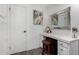 Bright bathroom vanity area with a large mirror and wooden stool on modern flooring at 4833 N 38Th St, Phoenix, AZ 85018