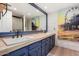 Stylish bathroom featuring a large vanity, double sinks, and a decorative accent wall and paintings at 4833 N 38Th St, Phoenix, AZ 85018