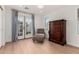 Bright bedroom features hardwood floors, a chaise lounge, and a wooden dresser, exuding cozy comfort at 4833 N 38Th St, Phoenix, AZ 85018