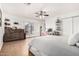 Bright bedroom features a ceiling fan, wood floors, and dresser, offering ample storage and style at 4833 N 38Th St, Phoenix, AZ 85018