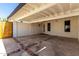 Open carport with brick trim and a door leading to the interior of the home at 4833 N 38Th St, Phoenix, AZ 85018