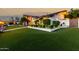 Home exterior showcasing lush green lawn, manicured hedges, and beautiful landscaping with a gazebo at 4833 N 38Th St, Phoenix, AZ 85018