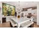 Modern kitchen with a large island, chandelier and brick wall at 4833 N 38Th St, Phoenix, AZ 85018