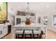 Open kitchen boasts a large island with seating, white countertops, stainless steel appliances, and brick backsplash at 4833 N 38Th St, Phoenix, AZ 85018