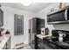 Kitchen with stainless steel appliances, dark cabinets, and unique flooring at 4833 N 38Th St, Phoenix, AZ 85018