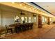 Expansive covered patio showcases a rustic dining table illuminated by string lights for evening enjoyment at 4833 N 38Th St, Phoenix, AZ 85018