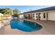 Backyard pool with grill station and covered patio in a beautiful outdoor setting, great for entertaining at 4833 N 38Th St, Phoenix, AZ 85018