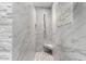 Modern tiled shower with built in seat and unique stone tile flooring at 4833 N 38Th St, Phoenix, AZ 85018