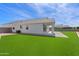 Beautiful backyard with artificial grass, ideal for relaxation and outdoor activities at 486 E Bamboo Ln, San Tan Valley, AZ 85140