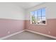 Bright bedroom with pink wainscoting and carpet floors, creating a cozy atmosphere at 486 E Bamboo Ln, San Tan Valley, AZ 85140
