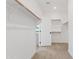 Bright walk-in closet with carpet flooring, wooden rails, and white shelving at 486 E Bamboo Ln, San Tan Valley, AZ 85140