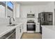 Clean kitchen featuring stainless appliances, a large sink and a white countertop at 486 E Bamboo Ln, San Tan Valley, AZ 85140