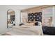 Comfortable bedroom featuring stylish decor, a large window, and ample natural light at 4936 S 106Th Ln, Tolleson, AZ 85353