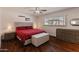 Cozy bedroom with neutral décor, a large window, and wood-look floors at 4944 W Vista Ave, Glendale, AZ 85301