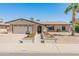 Charming single-story brick home with a well-manicured front yard and attached two-car garage at 4944 W Vista Ave, Glendale, AZ 85301