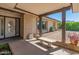 Inviting front porch with brick accents, a concrete bench, and glass front door at 4944 W Vista Ave, Glendale, AZ 85301